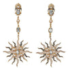 Blue Topaz and Pearl Sunburst earrings: Gold, sunburst design with blue topaz and pearls.