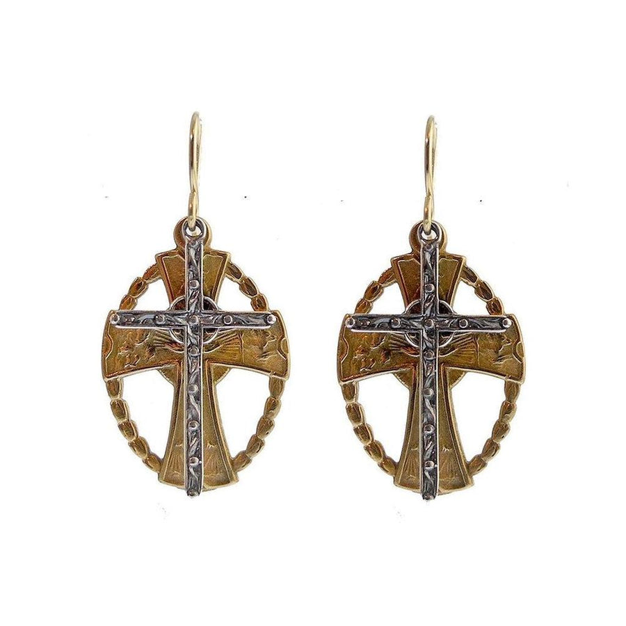 Bronze and silver cross earrings with intricate detailing.