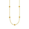 Casablanca Station Necklace: Gold chain necklace with four textured ball accents.