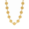Gold coin necklace with embossed detailing and tiny diamonds.