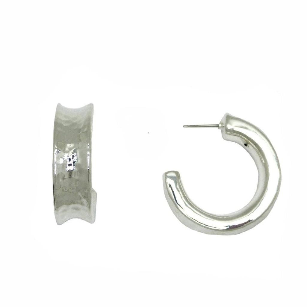 Silver indented hoop earrings; textured, modern design.