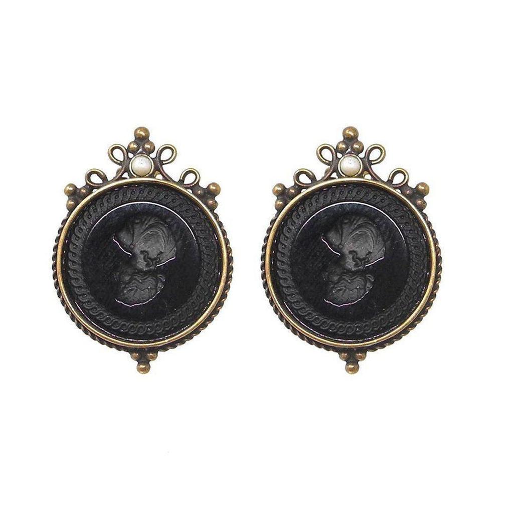 Jet Round Intaglio clip earrings with antique brass finish and pearl accents.