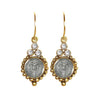 Joanna San Benito gold earrings with St. Benedict medallions and clear cubic zirconia accents.