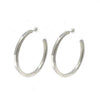Silver large hoop earrings; modern, minimalist design.