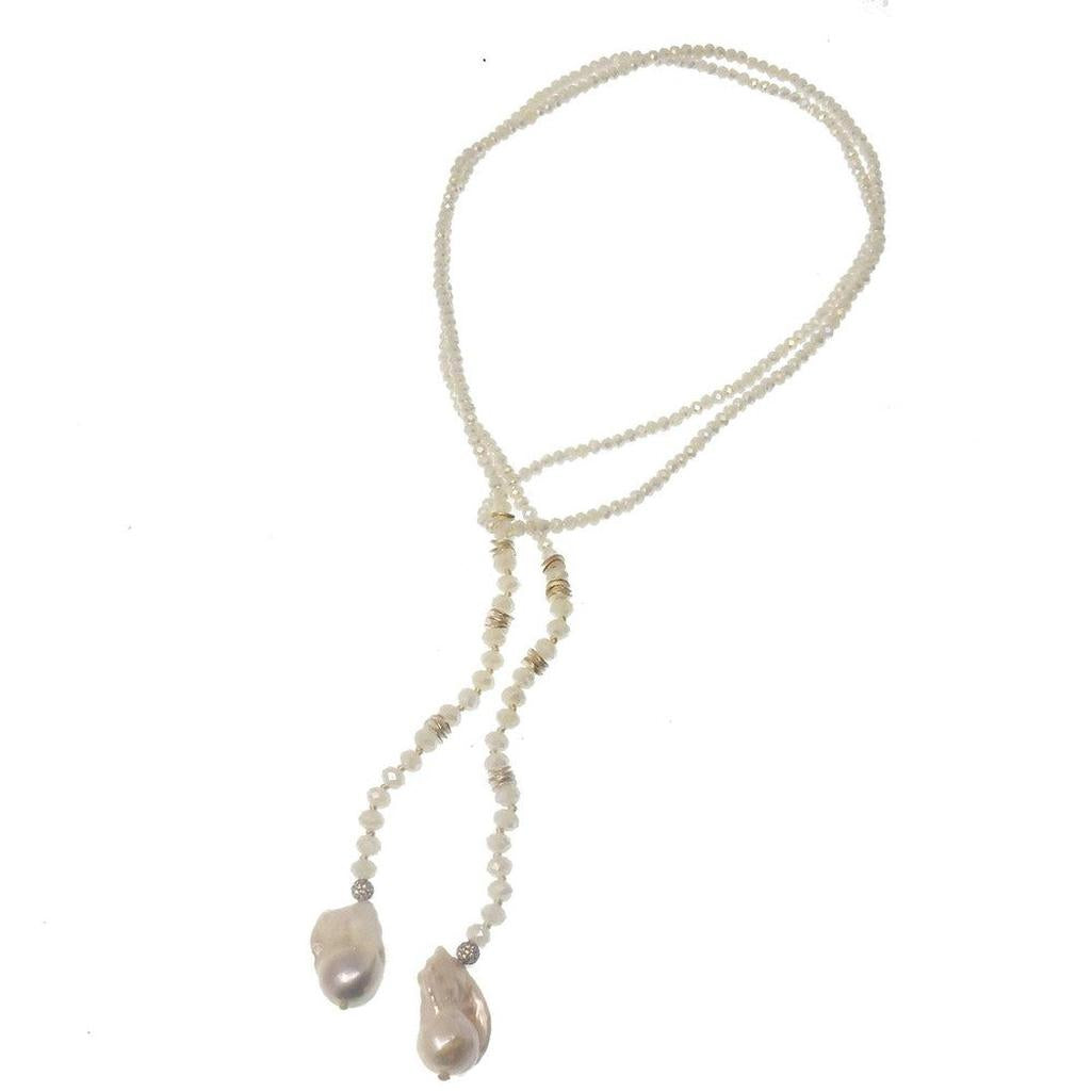 Elegant lariat necklace featuring baroque pearls and crystal beads; perfect for adding a touch of sophistication to any outfit.