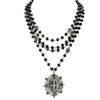 Magdalena 6mm Jet necklace: layered black beads, silver chain, & ornate pendant.