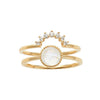 Gold double-band ring featuring a moonstone and diamond accents.