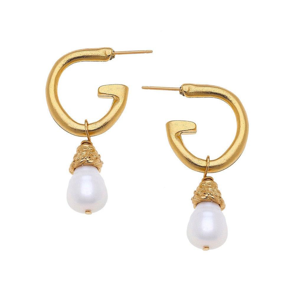 Gold hoop earrings with dangling pearl accents
