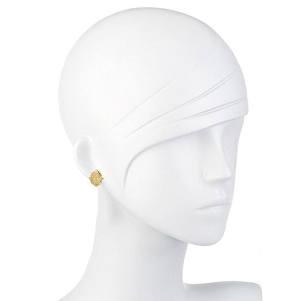 Gold oval dragonfly earrings on a mannequin.