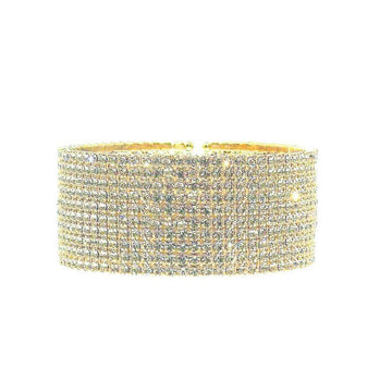 Gold bracelet with clear stones on a white background