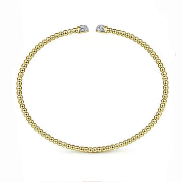 14K gold beaded bangle bracelet with diamond accents.
