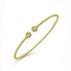 14K yellow gold Bujukan split cuff bracelet with diamond flower caps.
