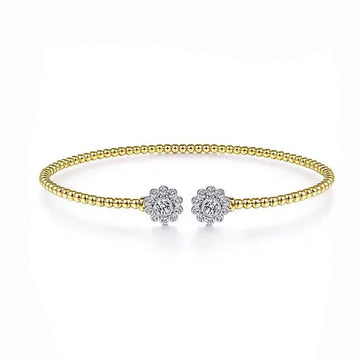 14K gold beaded cuff bracelet adorned with diamond floral accents.
