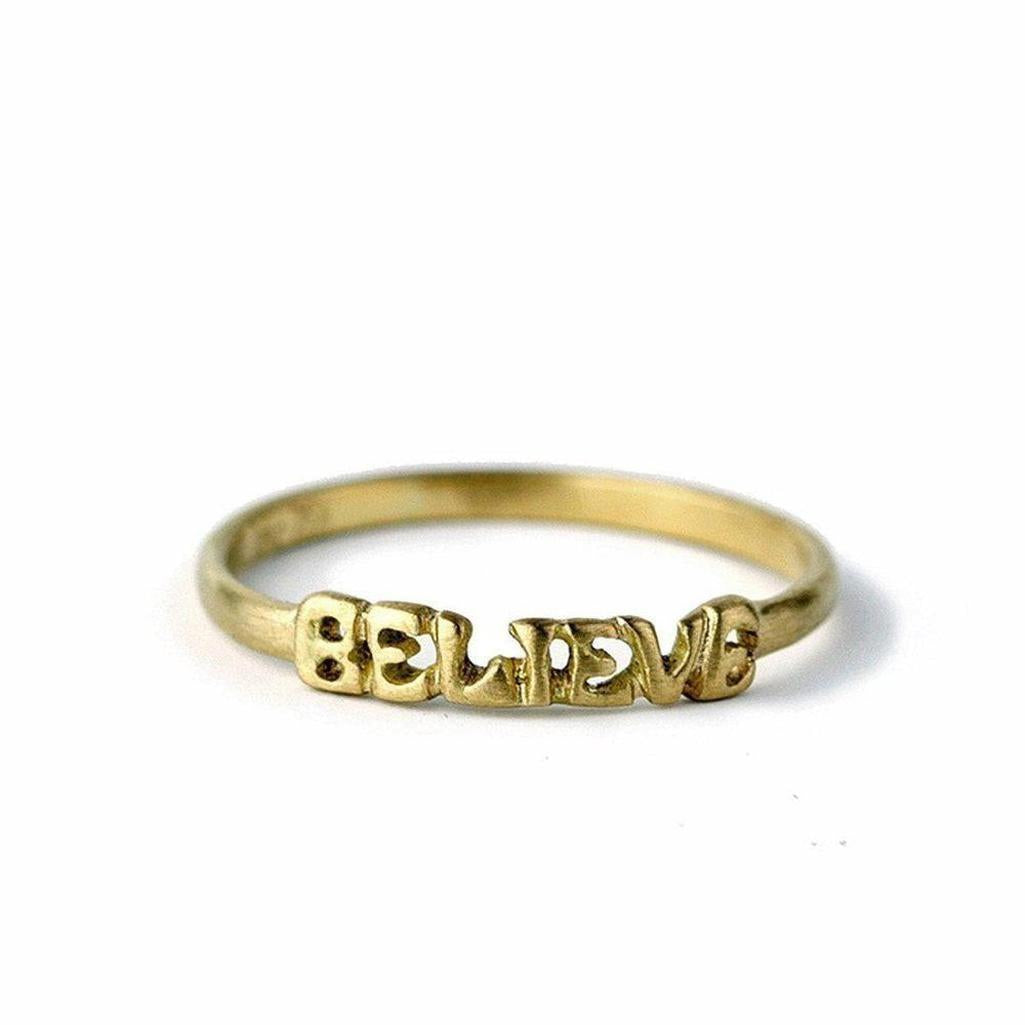 18k yellow gold Believe ring, inspirational statement jewelry.
