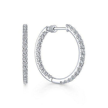1.2" inside-out diamond hoop earrings; sparkling white gold.
