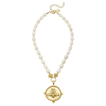 Gold bee pendant on a white pearl beaded necklace with an 18-inch chain and gold extender.