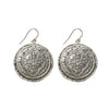 Alcazar silver coin hook earrings with ornate detailing.
