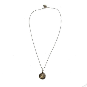Silver ball chain necklace with a small, ornate pendant.
