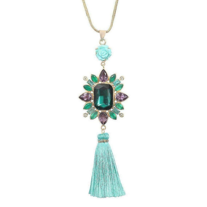 Amethyst & Turquoise Tassel Necklace:  Gold chain, large emerald green gemstone, purple & green accents, turquoise tassel.

