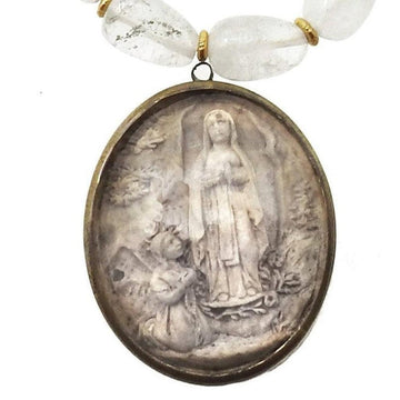 Antique Carved Icon of St. Anne necklace: Clear quartz beads & bronze oval pendant featuring St. Anne & child.
