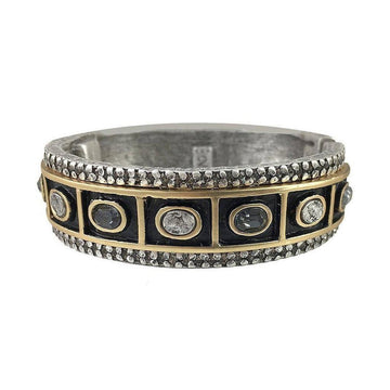 Ashta Thick Oval Hinged Bangle Bracelet:  Silver and gold hinged bangle with black enamel and clear & smoky quartz stones.
