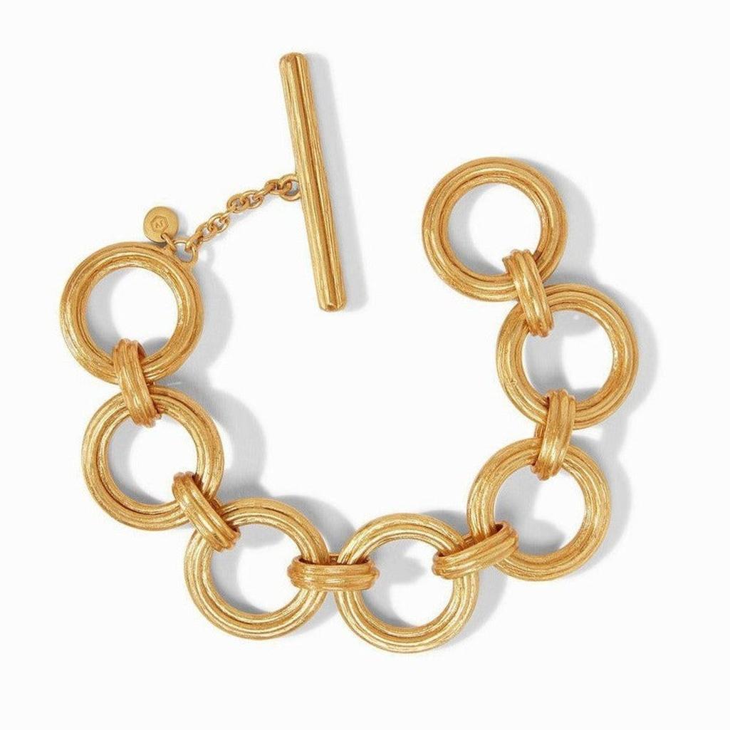 Gold Barcelona Link Bracelet with textured, interlocking rings and a t-bar clasp.
