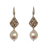 Baroque pearl drop earrings with rose gold diamond and pearl accents.
