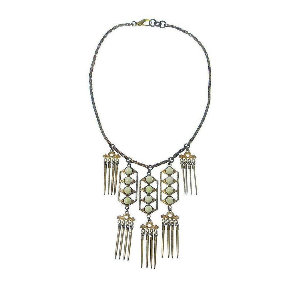 Beachcomber necklace: gold & bronze chain, off-white stones, geometric pendant with fringe accents.
