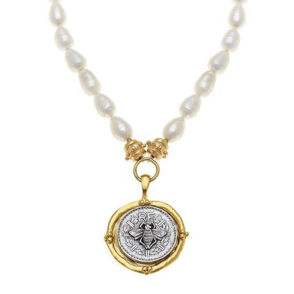 Bee Coin Pendant Necklace: Gold & silver bee coin pendant on a delicate pearl strand.
