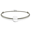 Silver disc bracelet with "Best Friend" inscription, on olive green cord.
