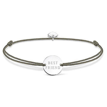 Silver disc bracelet with "Best Friend" inscription, on olive green cord.
