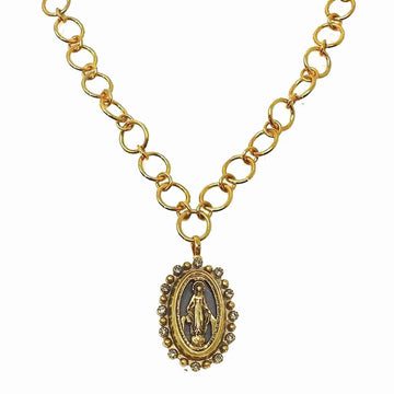 Gold chain necklace with oval Virgin Mary pendant, adorned with small crystals.
