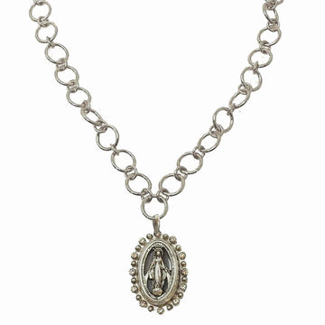 Silver chain necklace featuring an oval medallion pendant with religious imagery.

