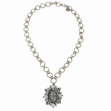 Silver chain necklace with ornate crystal-encrusted pendant.
