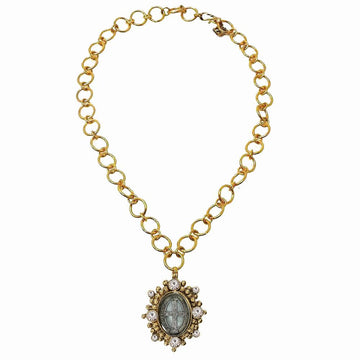 Gold chain necklace featuring an oval pendant accented with sparkling stones.
