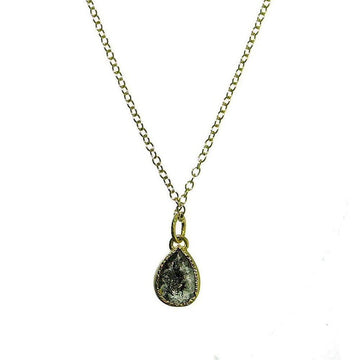 18k gold necklace featuring a pear-shaped black diamond pendant.
