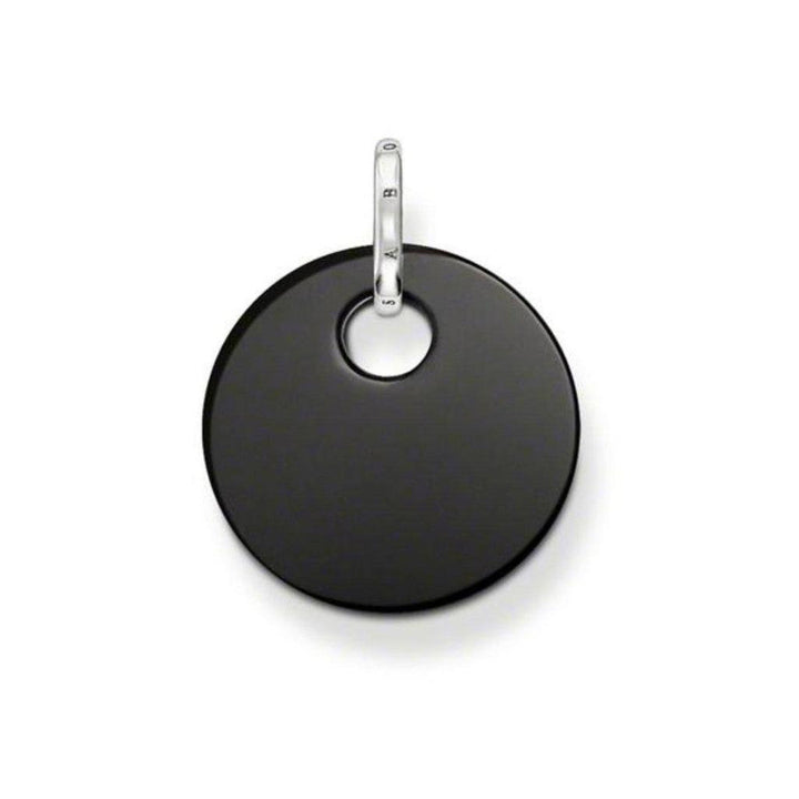 Black disc pendant with silver bail; minimalist jewelry.
