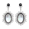Elegant black onyx and mother-of-pearl earrings with baguette-cut cubic zirconia accents.
