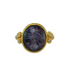 Oval blue sapphire ring in 18k gold with diamond accents
