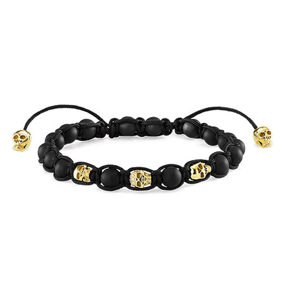 Black obsidian and gold skull beaded bracelet with adjustable cord.
