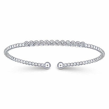 Beaded cuff bracelet featuring twelve bezel-set diamonds.
