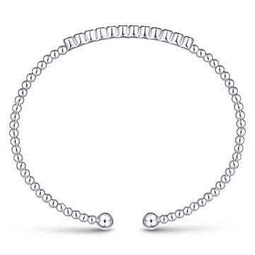 Beaded cuff bracelet featuring a row of diamonds.
