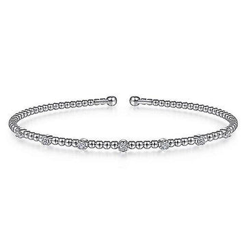 Beaded diamond bracelet with small, clustered diamonds.
