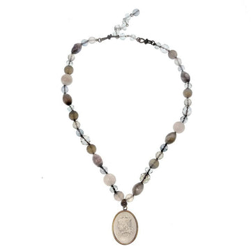 Elegant beaded necklace featuring grey and pink stones, adorned with a cameo pendant.
