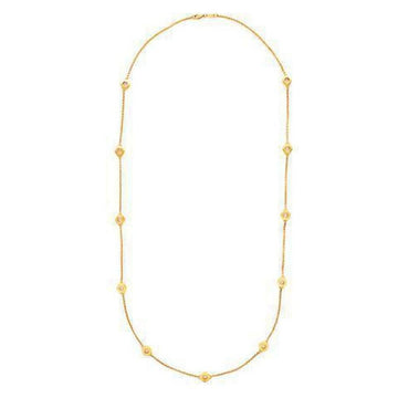 Gold station necklace featuring delicate chain and shimmering accents.
