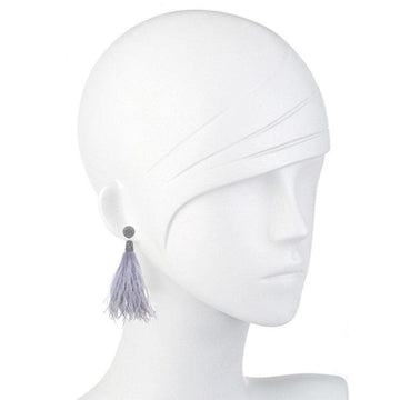 Light gray feather earrings with silver beaded accents, displayed on a mannequin.

