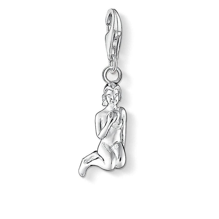 Charm 0589 Virgo Virgin silver charm depicting a seated woman.
