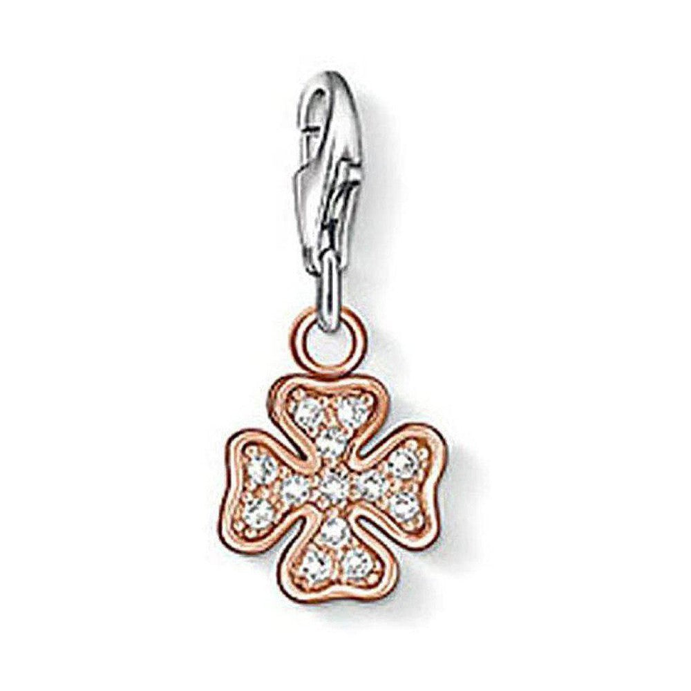 Rose gold cloverleaf charm with clear cubic zirconia, silver clasp.
