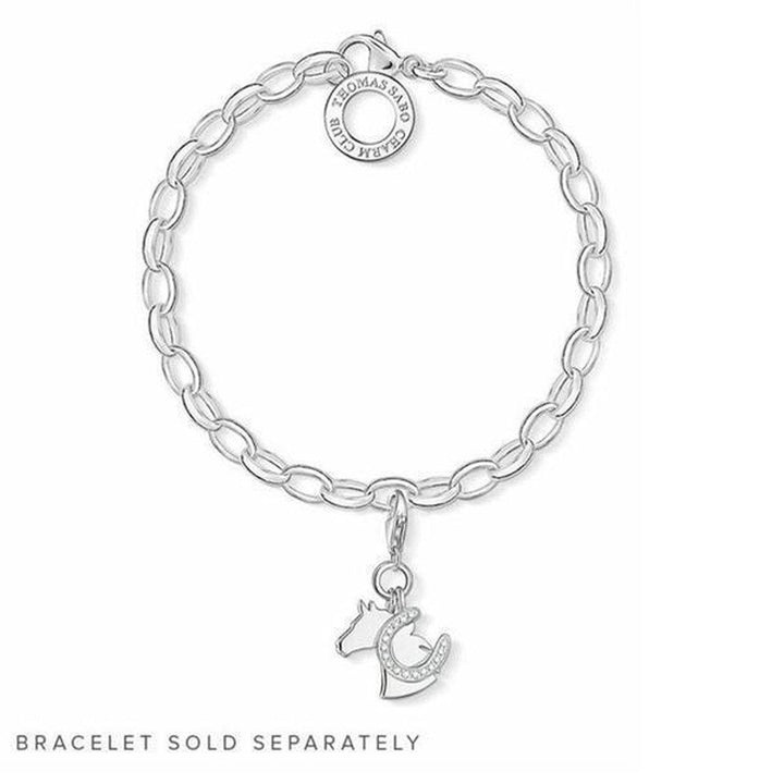 Silver horse charm with horseshoe detail, hanging from a chain bracelet (bracelet sold separately).
