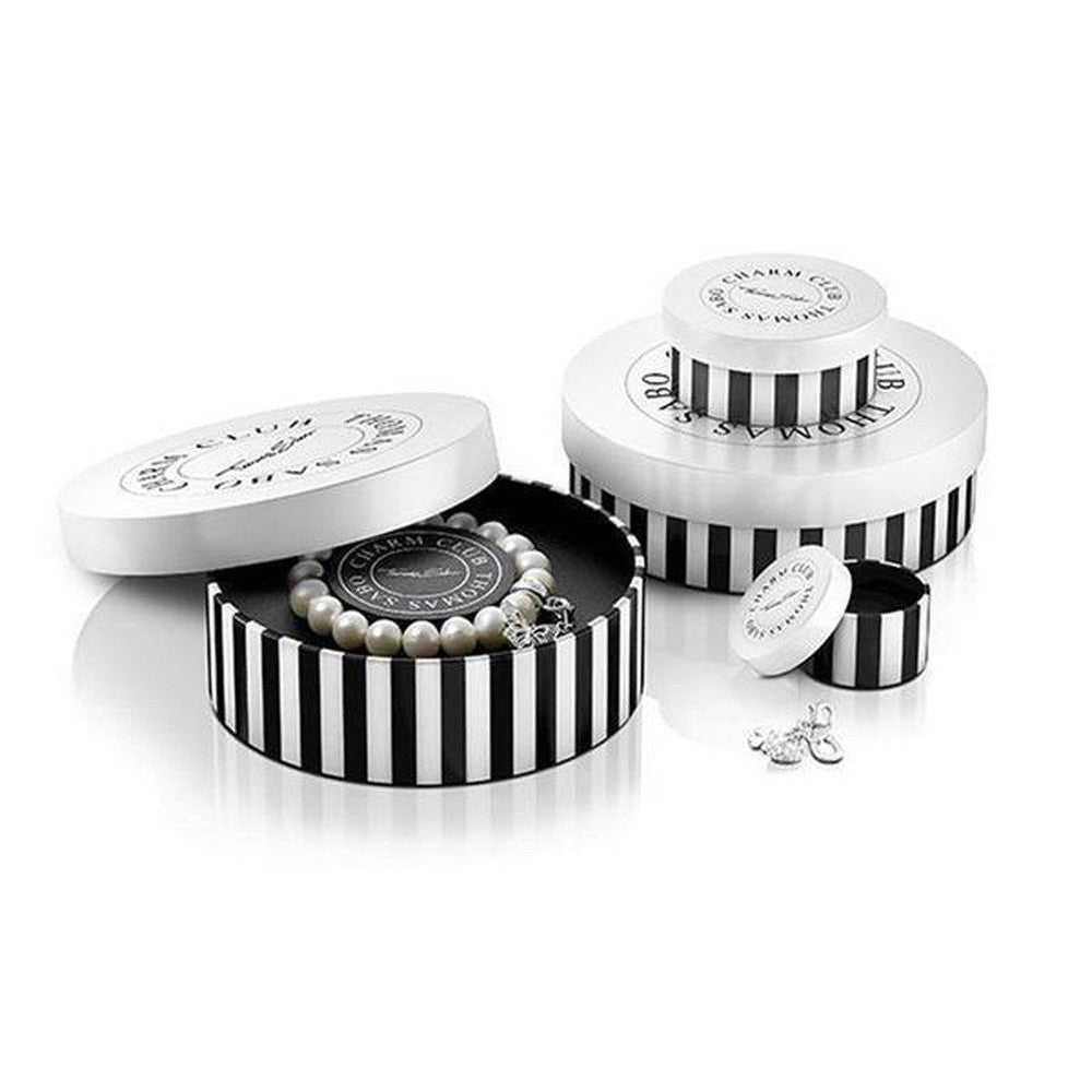 Pearl bracelet in black-and-white striped gift box.
